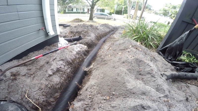 Solid Pipe Discharge from French Drain, leads to discharge at Curb, Apple Drains